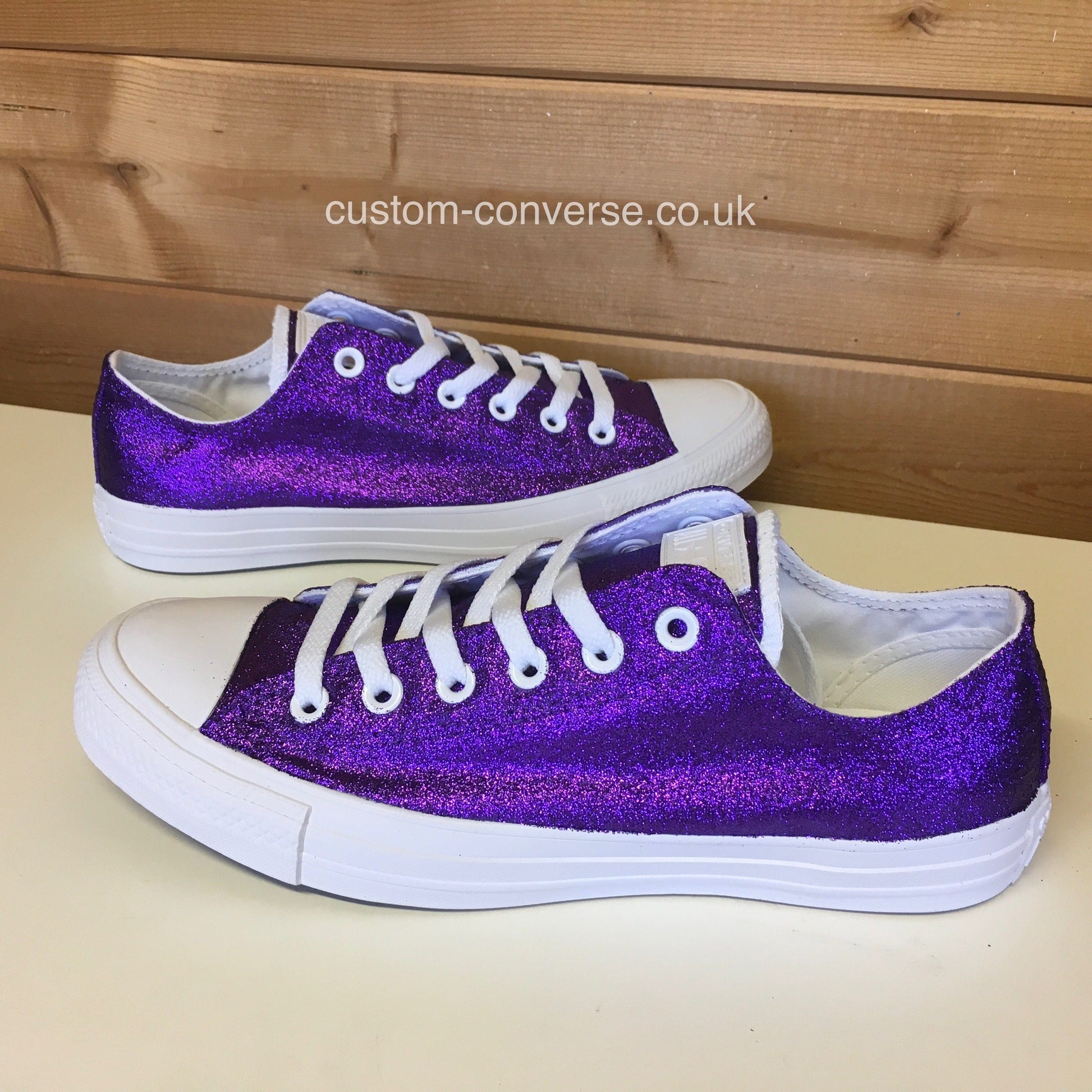 purple low top glitter converse sneakers